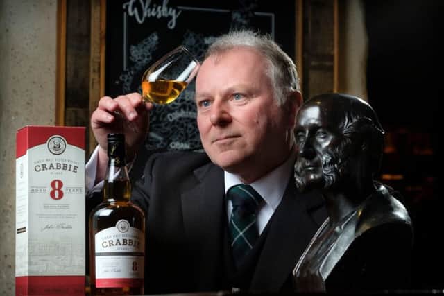 David Brown with a bottle of Crabbie's whisky. The firm is reviving its whisky business with a new distillery in Leith. Picture: Contributed