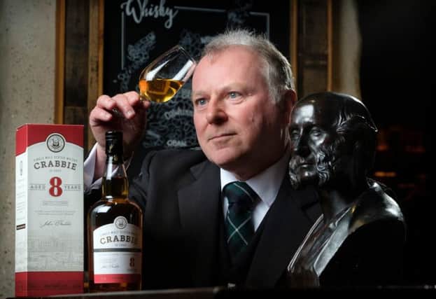 David Brown with a bottle of Crabbie's whisky. The firm is reviving its whisky business with a new distillery in Leith. Picture: Contributed