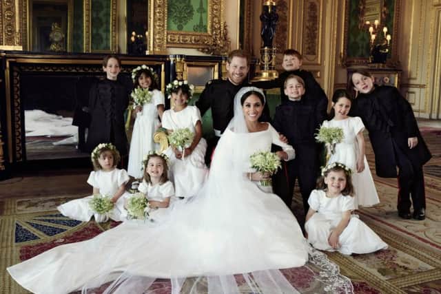 The Duke and Duchess of Sussex pose for an official wedding photograph with (left-to-right): Back row: Master Brian Mulroney, Miss Remi Litt, Miss Rylan Litt, Master Jasper Dyer, Prince George, Miss Ivy Mulroney, Master John Mulroney. Front row: Miss Zalie Warren, Princess Charlotte, Miss Florence van Cutsem in The Green Drawing Room. Picture: Alexi Lubomirski/The Duke and Duchess of Sussex via Getty Images