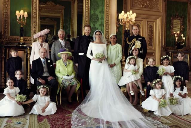 The Duke and Duchess of Sussex pose for an official wedding photograph with (left-to-right): Back row: Master Jasper Dyer, the Duchess of Cornwall, the Prince of Wales, Ms. Doria Ragland, The Duke of Cambridge; middle row: Master Brian Mulroney, the Duke of Edinburgh, Queen Elizabeth II, the Duchess of Cambridge, Princess Charlotte, Prince George, Miss Rylan Litt, Master John Mulroney; Front row: Miss Ivy Mulroney, Miss Florence van Cutsem, Miss Zalie Warren, Miss Remi Litt in The Green Drawing Room at Windsor Castle. Picture: Alexi Lubomirski/The Duke and Duchess of Sussex via Getty Images