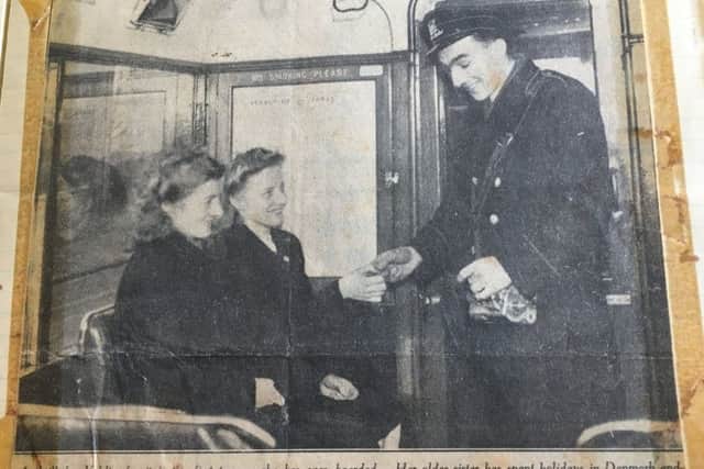 The caption from the Weekly 1949 Scotsman article reads..
"A thrill for Valdis, for it is the first tramcar she has ever boarded.  Her older sister has spent holidays in Denmark and Norway, but this is the first time Valdis has been away from home, and Thorshaun - chief town of the Faroes - is too small to need a public transport system.  Both girls know a little English, though they are still rather shy in attempting to speak it."

Picture: Jon Savafe