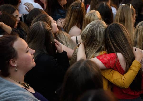 A group of young women hug during the 'Manchester Together - With One Voice' tribute concert on the first anniversary of the terrorist attack that claimed the lives of 22 people in the city  (Picture: Leon Neal/Getty Images)