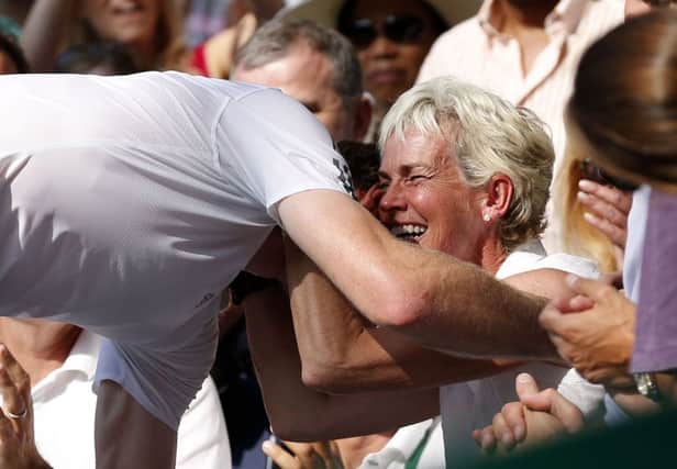 Andy Murray hugs his mother Judy Murray after winning the men's final at Wimbledon in 2013
