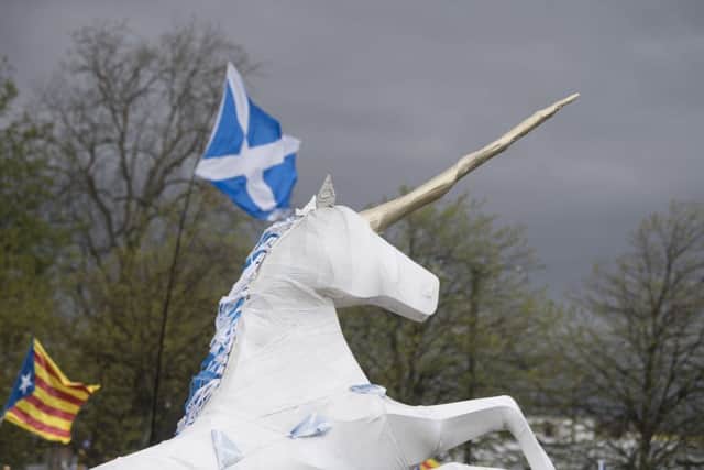 A homemade unicorn on display during a pro-independence march in Glasgow in May 2018. The SNP's long-awaited growth commission report will examine economic options of an independent Scotland. Picture: John Devlin/TSPL
