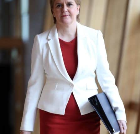 First Minister Nicola Sturgeon arrives ahead of First Minister's Questions at the Scottish Parliament in Edinburgh. Picture: PA Wire