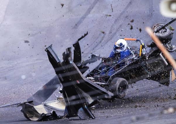Miracle escape for racing driver Ron Cumming after he crashed on Knockhill Racing Circuit in Fife. Picture: Centre Press