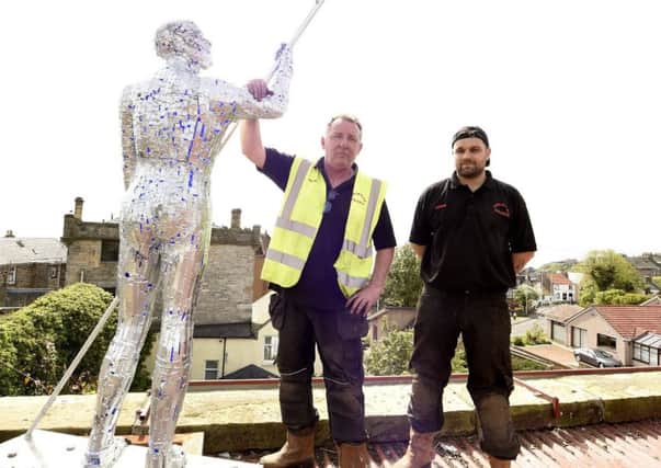 Andy Davies with his new sculpture - with blacksmith Chris Brown. Pic Fife Photo Agency.