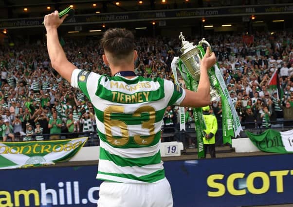 Kieran Tierney celebrates the double treble with the Celtic fans at Hampden. Picture: SNS Group