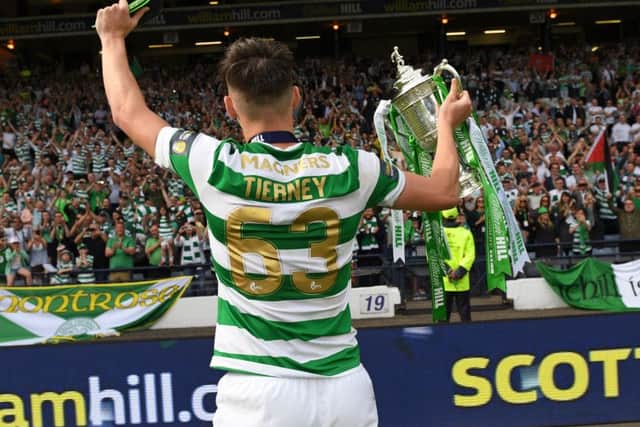 Kieran Tierney celebrates the double treble with the Celtic fans at Hampden. Picture: SNS Group