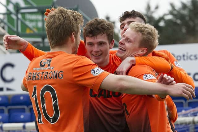 Andy Robertson, centre, celebrates a Gary Mackay-Steven goal with his then Dundee United team-mates. Picture: Bill Murray/SNS