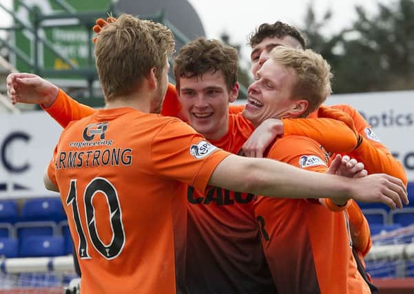 Andy Robertson, centre, celebrates a Gary Mackay-Steven goal with his then Dundee United team-mates. Picture: Bill Murray/SNS