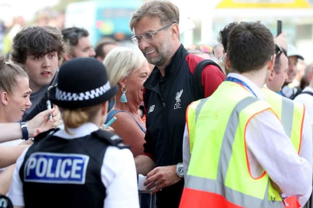 Jurgen Klopp with fans at John Lennon Airport ahead of Liverpools departure for Kiev. Picture: PA.