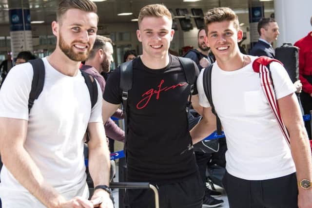 From left, Scotlands Stephen ODonnell, Chris Cadden and Ryan Christie arrive at Glasgow Airport before flying to Peru. Picture: SNS.