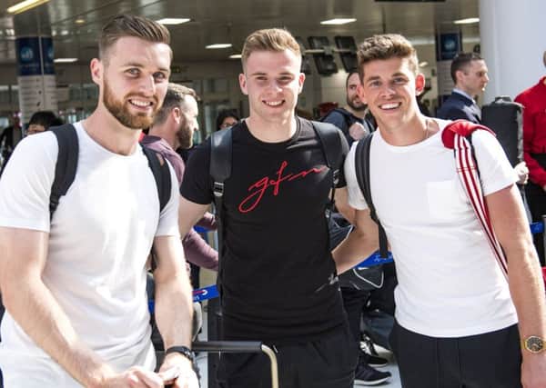 From left, Scotlands Stephen ODonnell, Chris Cadden and Ryan Christie arrive at Glasgow Airport before flying to Peru. Picture: SNS.
