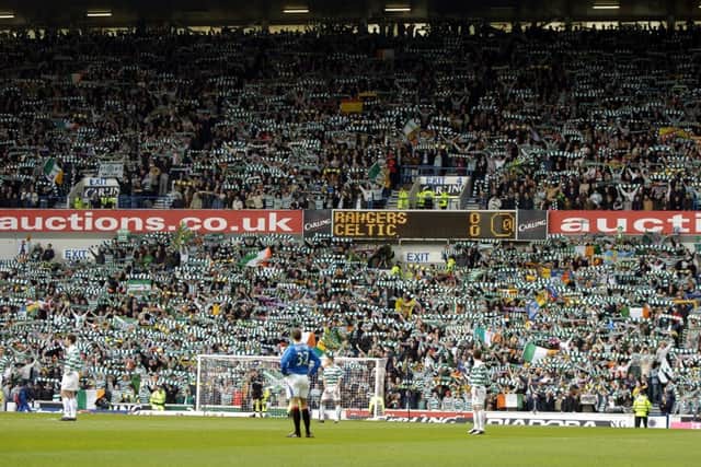 Celtic Fans at Ibrox befrore the start of the Old firm Derby.
Picture Robert Perry. Scotland on Sunday.