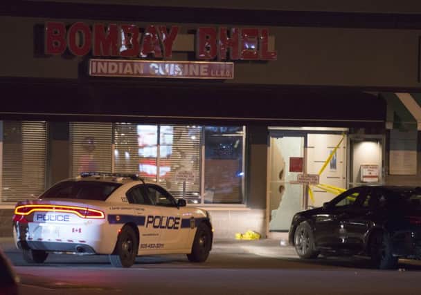 Police outside the Bombay Bhel restaurant in Mississauga, Canada. Picture: AP