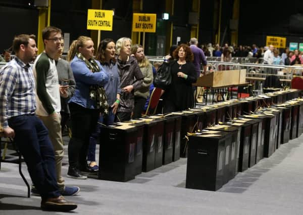 Workers wait to start counting votes at Dublin's RDS. Picture: PA Wire