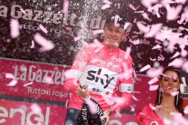 Chris Froome celebrates retaining the pink jersey after Stage 20 of the Giro dItalia. Photograph: Luk Benies/AFP/Getty