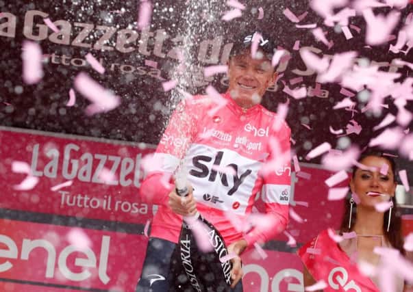 Chris Froome celebrates retaining the pink jersey after Stage 20 of the Giro dItalia. Photograph: Luk Benies/AFP/Getty