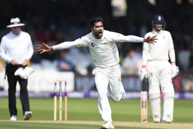 Mohammad Amir celebrates dismissing Jonathan Bairstow during day three of the first Test. Photograph: Gareth Copley/Getty
