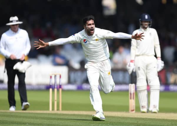 Mohammad Amir celebrates dismissing Jonathan Bairstow during day three of the first Test. Photograph: Gareth Copley/Getty