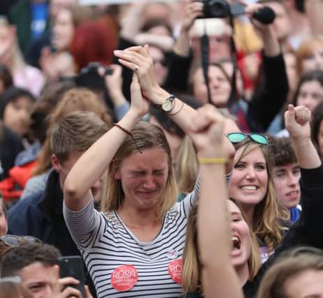 A woman breaks down in tears as the results are announced in the referendum. Picture: Niall Carson/PA Wire