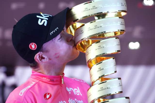 Chris Froomer kisses the trophy on the podium in Rome. Picture: AFP/Getty.