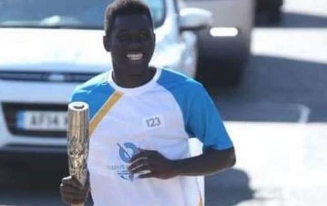 Former Paisley Grammar School pupil Denzel Darku carried the Queen's Commonwealth Games baton in 2014. Picture: Glasgow 2014