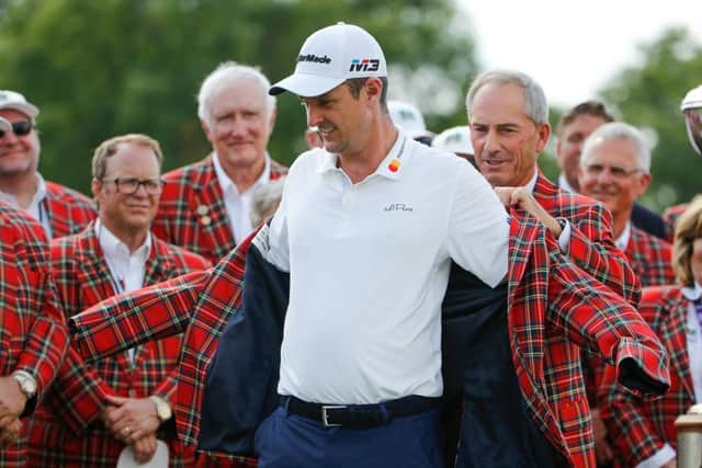 Justin Rose has the winner's tartan jacket slipped over his shoulders after triumphing at Colonial Country Club in Fort Worth. Picture: Getty Images