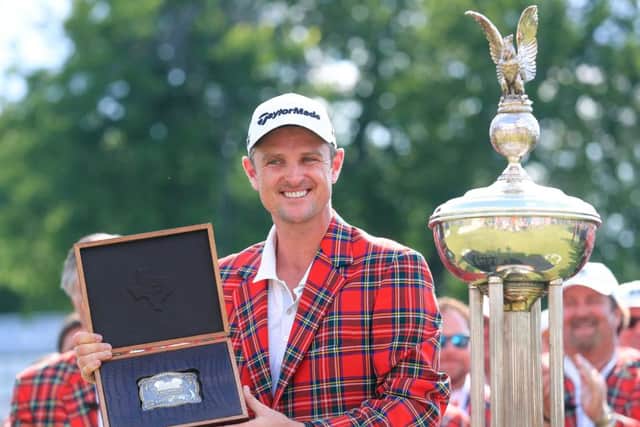 Justin Rose poses with a trophy belt buckle after winning the Fort Worth Invitational in Texas. Picture: Getty Images