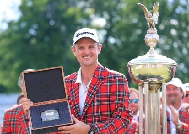 Justin Rose poses with a trophy belt buckle after winning the Fort Worth Invitational in Texas. Picture: Getty Images