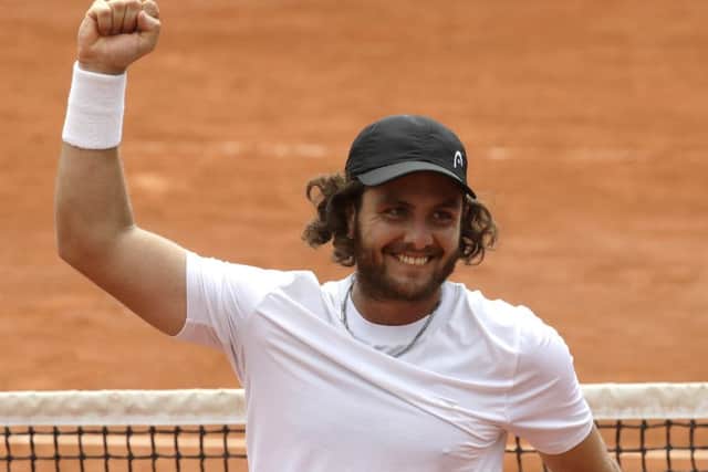 Argentina's Marco Trungelliti raises his fist in victory after defeating Australia's Bernard Tomic at the French Open. Picture: Alessandra Tarantino/AP