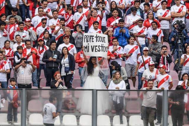 The Estadio Nacional del Peru was sold out for a Peru training session on Sunday when, main picture, a female fan proposed marriage to national coach Ricardo Gareca.