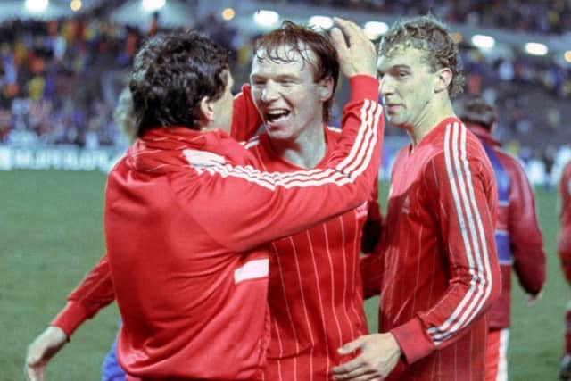 Alex McLeish (centre) celebrates the European Cup Winners' Cup Final win with Eric Black (left) and Neale Cooper (right). Picture: SNS Group