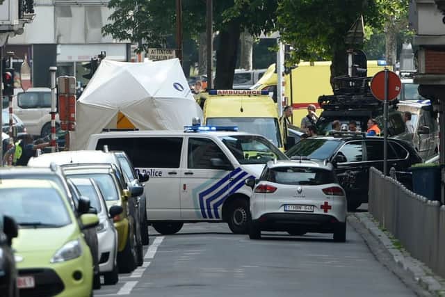 Emergency services at the scene where an armed man shot and killed police officers before being subdued by police in the eastern Belgian city of Liege. Picture: AFP/Getty