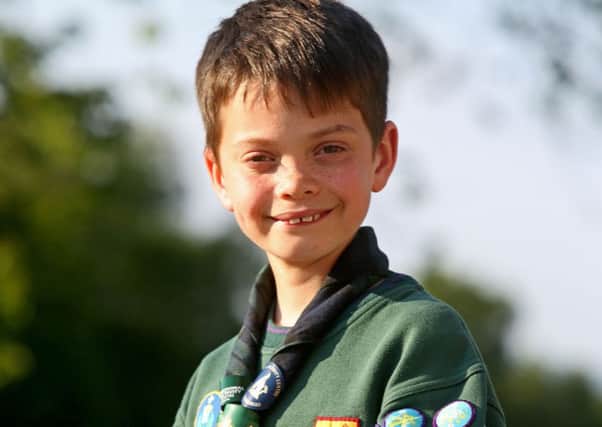 Picture:
Cub Scout Gregor Kennedy has notched up a record sixty badges, supplied