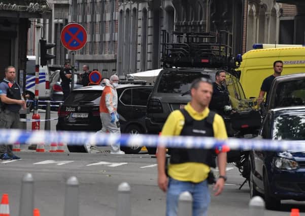A gunman killed three people, including two police officers, in the Belgian city of Liege on Tuesday, a city official said. Police later killed the attacker, and other officers were wounded in the shooting. Picture: AP