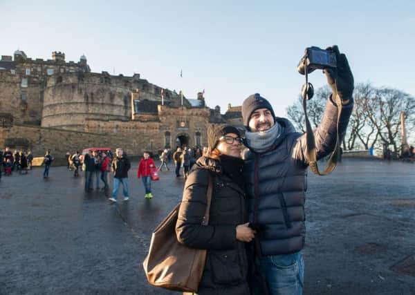 The Edinburgh Castle selfie is an essential part of a tourist's trip (Picture: Ian Georgeson)