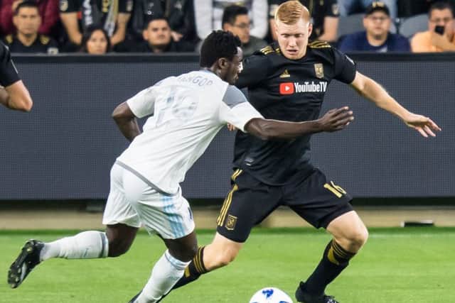 Calum Mallace of Los Angeles FC faces up to Frantz Pangop of Minnesota United . Picture: Shaun Clark/Getty Images