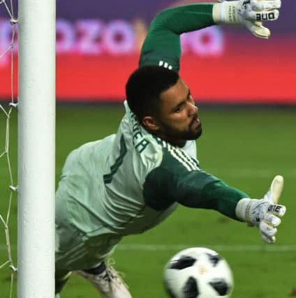 Alex McLeish partly absolved Jordan Archer of blame after the debutant keeper looked suspect at both goals. Picture: AFP/Getty Images