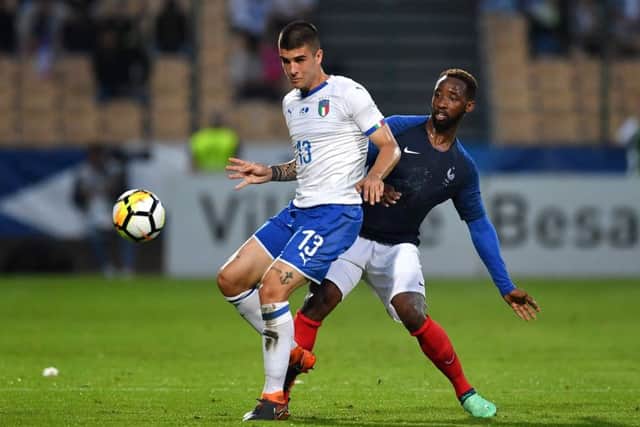 Moussa Dembele competes with Italy's Gianluca Mancini during the friendly match in Besancon, France.  Picture: Valerio Pennicino/Getty Images