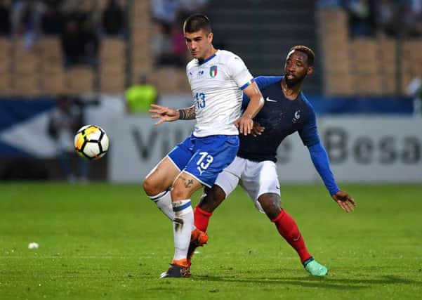 Moussa Dembele competes with Italy's Gianluca Mancini during the friendly match in Besancon, France.  Picture: Valerio Pennicino/Getty Images