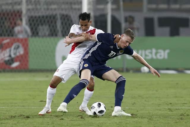 Yoshimar Yotun of Peru fights for the ball against Scott McTominay. Picture: AFP/Getty Images