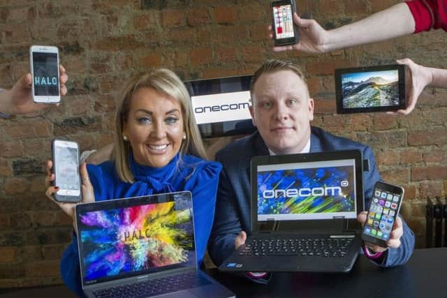 Marie Macklin, founder and executive chair of the Halo Group, and Paul Lawther, head of Onecom Northern Ireland. Picture: Peter Devlin