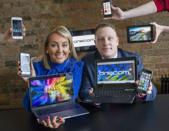 Marie Macklin, founder and executive chair of the Halo Group, and Paul Lawther, head of Onecom Northern Ireland. Picture: Peter Devlin