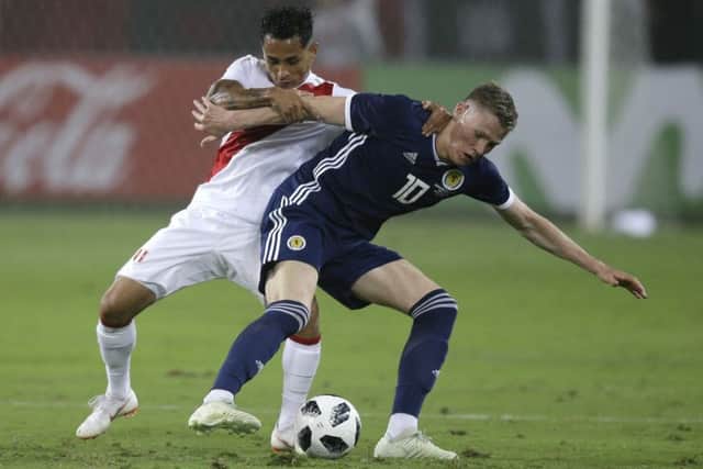Peru's Yoshimar Yotun fights for the ball with Scotland's Scott McTominay. Picture: Martin Mejia/AP