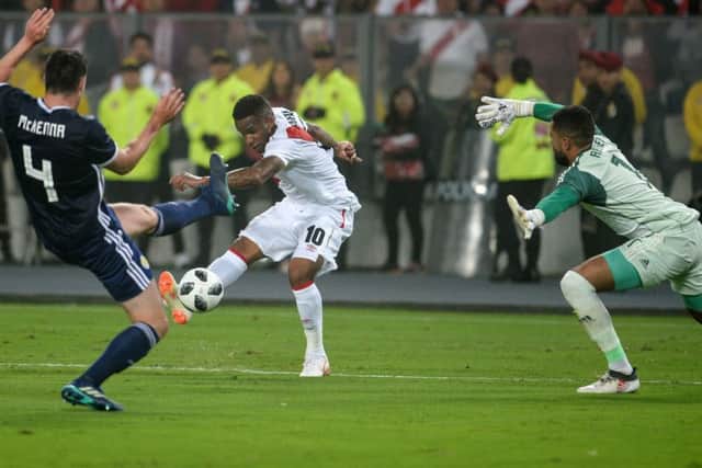 Jefferson Farfan, who won the penalty for the first goal and scored the second, fires in a shot towards Jordan Archer in the Scotland goal during Perus 2-0 win in Lima. Picture: Ernesto Benavides/AFP/Getty