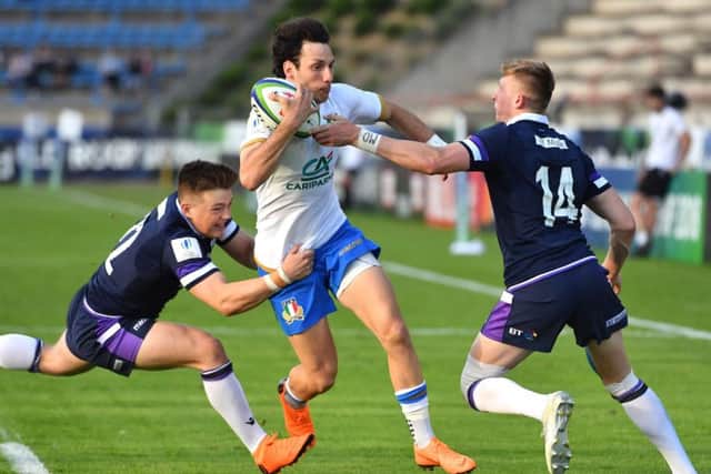 Callum McLelland, left, and Logan Trotter combine to halt the progress of Italys Giovanni Donofrio in Beziers. Picture: Pascal Guyot/AFP/Getty