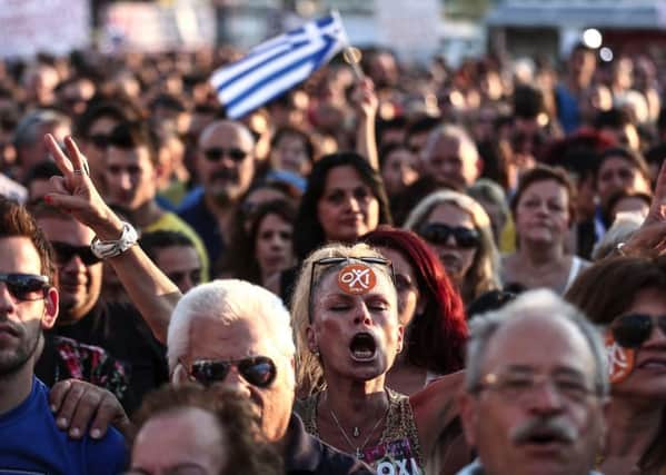 Supporters of Alexis Tsipras, Greece's prime minister, attend a No rally against accepting the EU's bailout conditions in Athen's Syntagma Square in 2015. (Picture: Bloomberg via Getty)
