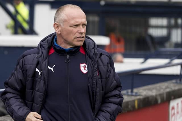 John Hughes failed to save the club from relegation. Picture: SNS